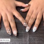 Brown And White Nail Designs On A Table