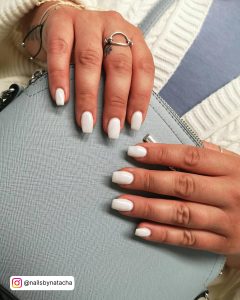 Chic White Summer Nails Over Grey Bag