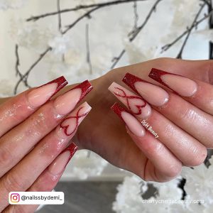 Coffin Shape Dark Red Valentine Nails With French Tip Design And Heart Outline
