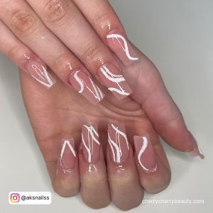 Coffin Shaped Acrylic Nails With White Swirls
