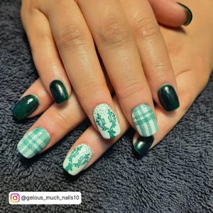 Dark Green And White Acrylic Nails On A Carpet