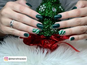 Dark Green And White Nails Covering A Christmas Tree