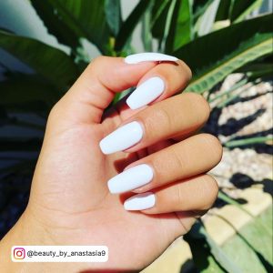 Elegant Coffin Summer White Nails Ideas With Leaves In Background