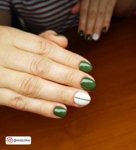 Emerald Green And White Nails On A Table