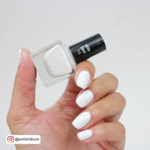 Fabulous Summer White Gel Nails Over Holding A White Gel Polish White Background