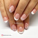 French Nails With White Flower For A Simple Look