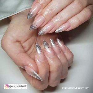 French Ombre Nails With Silver Glitter In Stilleto Shape
