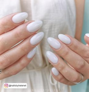 Glossy Milky White Nails For Summer With Milky White Dress In Background