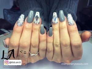 Gray And White Nail Ideas With Design On Two Fingers