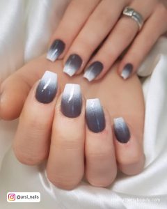 Gray White Ombre Nails On A White Surface