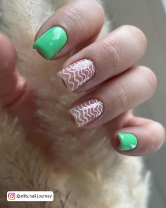 Green And White Christmas Nails Holding A Plant
