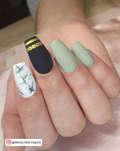 Green And White Nail Designs With One Black Nail