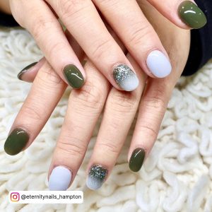 Green And White Nails With Ombre Effect On One Finger