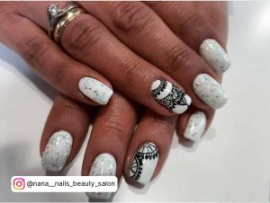 Henna Summer Nails With White And Glitter Over White Surface