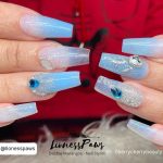 Light Blue Coffin Nails With Ombre, Glitter And Rhinestones