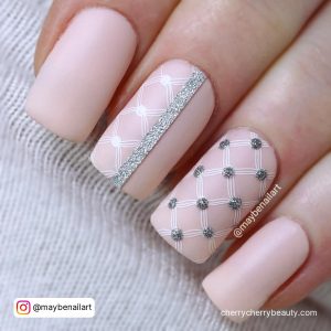 Light Pink And Silver Nails With Check Pattern