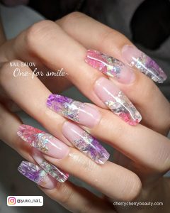 Long Bling Acrylic Nails In Pink And Purple