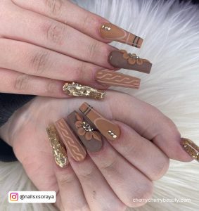 Long Brown Acrylic Nails With Flowers And Patterns
