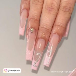 Long Coffin Nails With Light Pink French Tip, Cuticle Gem And 21 Written In Silver