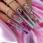 Long Coffin Nails With Nude Base, White Heart Nail Decor, Pink And Purple Heart Nail Confetti, Pink And Purple Rhinestones