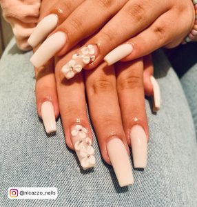 Long Flowery Milky White Summer Acrylic Nails Over Jean Surface
