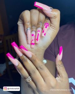 Long Nude And Hot Pink Coffin Nails With Hot Pink French Tip And 21 Written In Hot Pink
