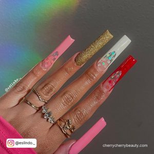 Long Square Tip Glam Valentine'S Day Acrylic Nail Designs With A Gold Glitter Nail, Pink Nails, A White French Tip Nail And A Red French Tip Nail