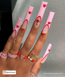 Long Square Tip Nude Nails With Light Pink French Tip And Red Heart Designs