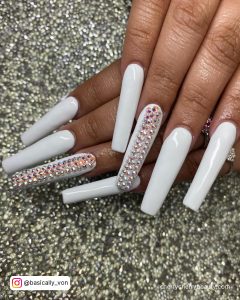 Long White Coffin Nails With Rhinestones On Middle Finger