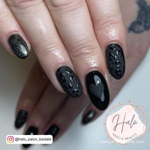 Matte Black, Glossy Black And Black Glitter Round Tip Nails With Heart Designs