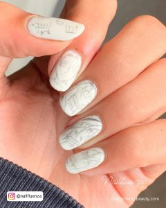 Matte White Acrylic Nails With Creative Design