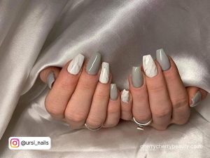 Nails Gray And White On A Silver Surface