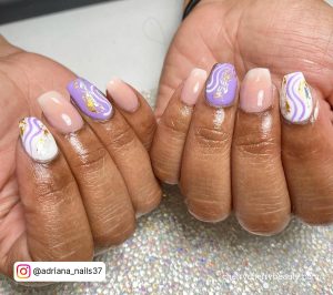 Nails White And Purple On A Glitter Surface