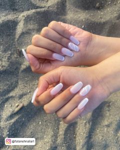 Nails With White Lines Design On Sand