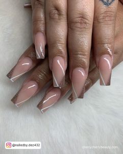 Nails With White Outline Along With Brown