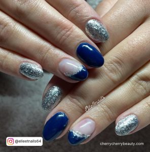Navy Blue Nails With Silver Glitter In Almond Shape