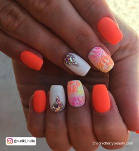 Neon Orange And White Nails With Rhinestones