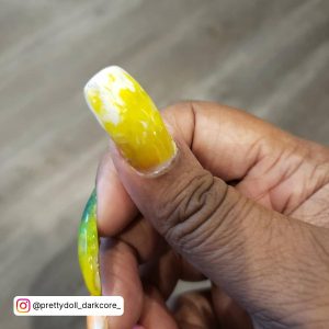 Neon Yellow And White Nails With Peacock Shades