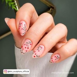 Nude Almond Nails With Black And Red Blossom Design