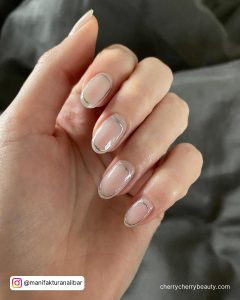 Nude And Silver Nails In Almond Shape