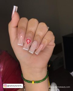 Nude Nails With White Outline And A Heart On One Finger