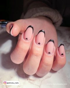 Nude Round Tip Nails With Black Tip And Small Black Heart On The Cuticle