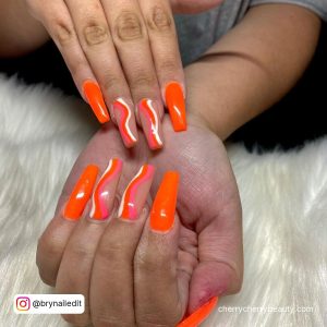 Orange And White Marble Nails For A Bright Look