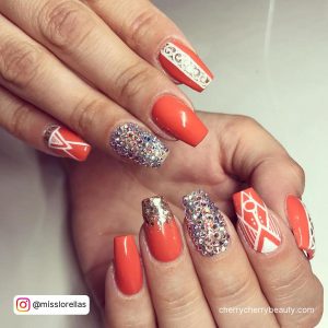 Orange And White Nail Designs With Clear Glitter On One Finger