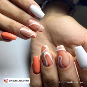 Orange And White Swirl Nails For A Marble Effect