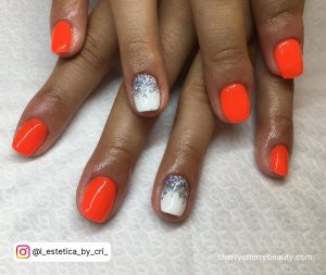 Orange Nails With White Design In Neon Shade