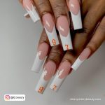 Orange White Nails With Numbers On It