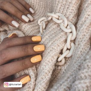 Orange Yellow And White Nails On A Sweater