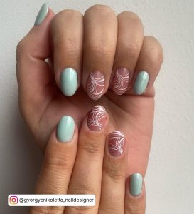 Oval Nails With White Lines And Blue Nail Paint