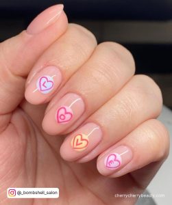 Pastel Colored Love Written In Hearts On Short Nude Valentine Gel Nails